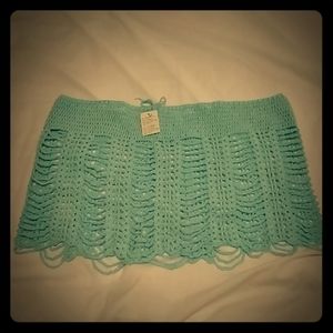 Shrug or bathing suit  cover with draw string.